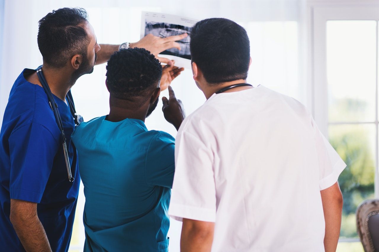 doctors examining x-ray